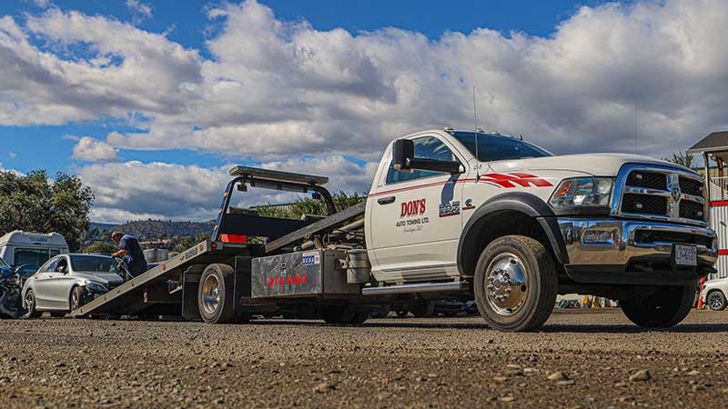 Dons Towing picking up a car